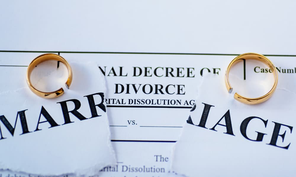 divorce papers with rings