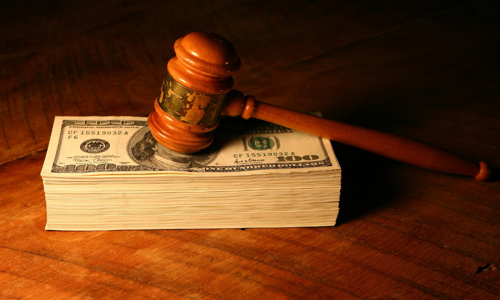 One of the benefits of settling a divorce out of court is the money on gavel